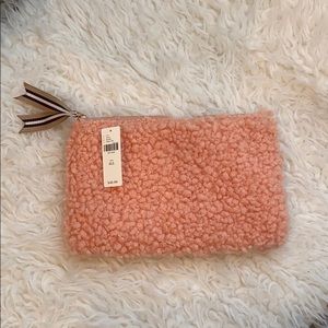 Anthropologie blush shearling clutch